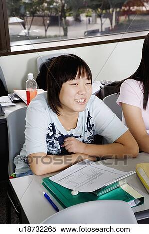 Stock Photography - High angle view of teenage students in the classroom. Fotosearch