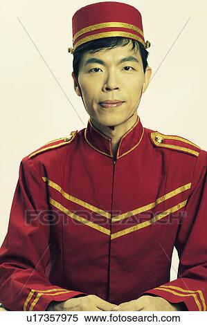 Portrait of a bellhop posing View Large Photo Image Stock Photography - Portrait of a bellhop posing. Fotosearch