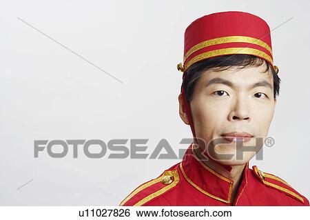 Portrait of a bellhop thinking View Large Photo Image Stock Photograph - Portrait of a bellhop thinking. Fotosearch