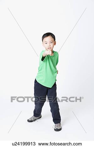 Stock Image - Portrait of a boy in a fighting stance. Fotosearch