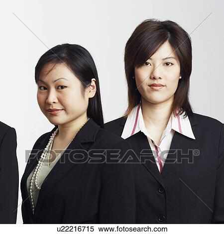 Portrait of a businessman with two businesswomen View Large Photo Image Stock Photography - Portrait of a businessman with two businesswomen. Fotosearch