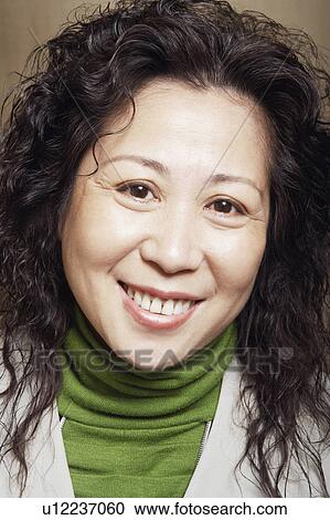 Stock Image - Portrait of a businesswoman smiling. Fotosearch