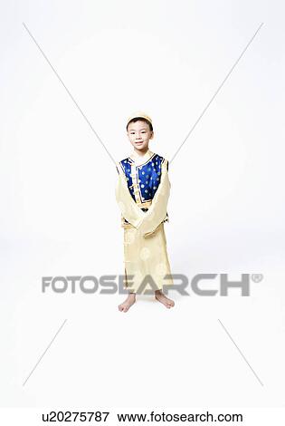 Stock Photo - Portrait of a child in traditional clothing. Fotosearch