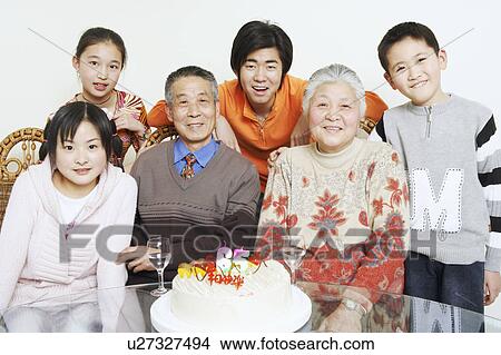 Portrait of a family at a birthday party View Large Photo Image Picture - Portrait of a family at a birthday party. Fotosearch