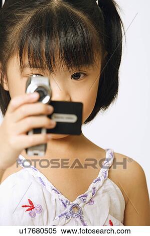 Portrait of a girl holding a home video camera View Large Photo Image Stock Photography - Portrait of a girl holding a home video camera. Fotosearch