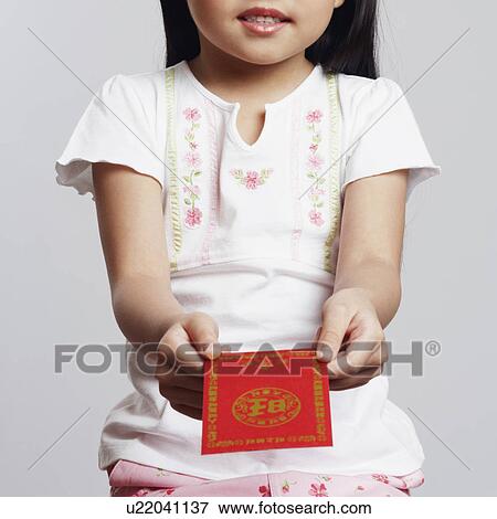 Portrait of a girl holding an envelope View Large Photo Image Stock Photo - Portrait of a girl holding an envelope. Fotosearch