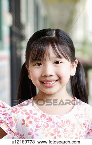 Portrait of a girl smiling View Large Photo Image Stock Photo - Portrait of a girl smiling. Fotosearch