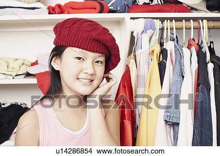 Picture - Portrait of a girl wearing a hat. Fotosearch