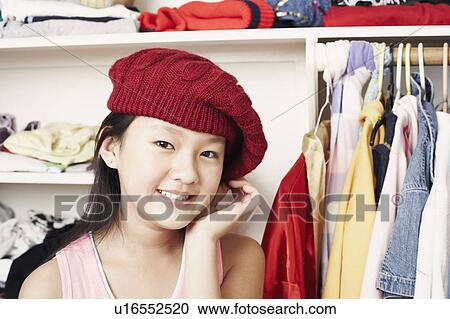 Portrait of a girl wearing a hat View Large Photo Image Stock Image - Portrait of a girl wearing a hat. Fotosearch