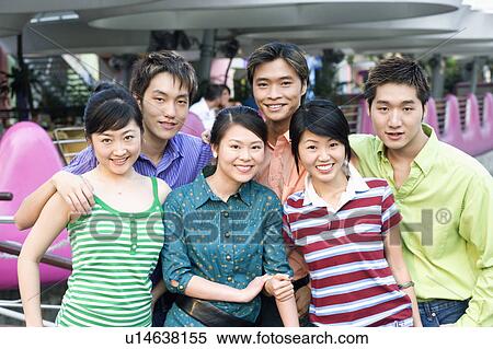 Portrait of a group of people standing together and smiling View Large Photo Image Stock Photography - Portrait of a group of people standing together and smiling. Fotosearch