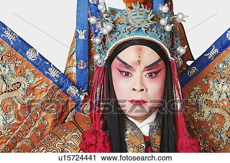 Stock Image - Portrait of a male Chinese opera performer looking serious. Fotosearch