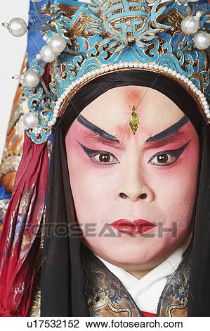 Stock Image - Portrait of a male Chinese opera performer looking serious. Fotosearch