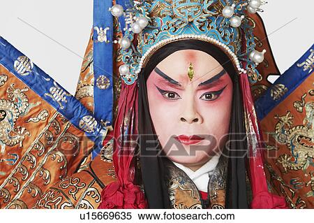 Stock Photography - Portrait of a male Chinese opera performer looking serious. Fotosearch