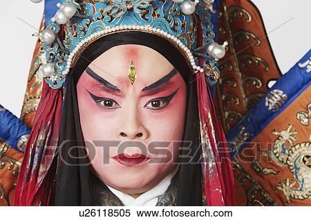 Stock Photography - Portrait of a male Chinese opera performer looking serious. Fotosearch