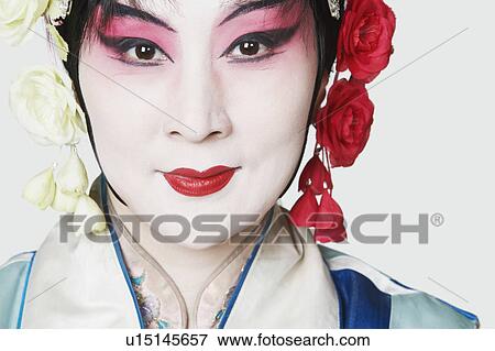 Stock Photo - Portrait of a mature woman wearing traditional clothing. Fotosearch