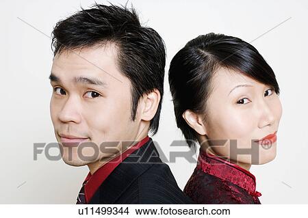 Picture - Portrait of a mid adult man and a young woman smiling. Fotosearch