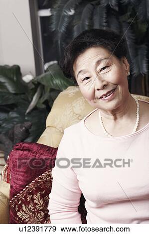 Stock Photo - Portrait of a senior woman smiling. Fotosearch