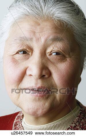 Portrait of a senior woman smiling View Large Photo Image Stock Photo - Portrait of a senior woman smiling. Fotosearch