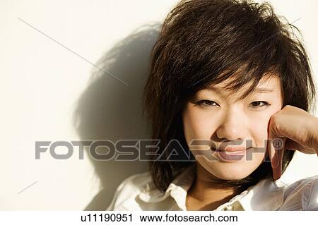 Stock Image - Portrait of a teenager girl posing. Fotosearch