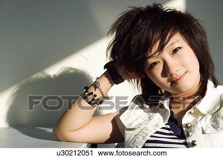 Portrait of a teenager girl posing View Large Photo Image Stock Image - Portrait of a teenager girl posing. Fotosearch