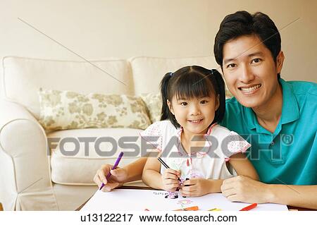 Portrait of a young man with his son and daughter View Large Photo Image Stock Photo - Portrait of a young man with his son and daughter. Fotosearch
