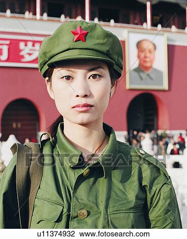"Portrait of a young woman in army uniform standing in front of a palace, Forbidden Palace, Beijing, China" View Large Photo Image Stock Image - "Portrait of a young woman in army uniform standing in front of a palace, Forbidden Palace, Beijing, China". Fotosearch