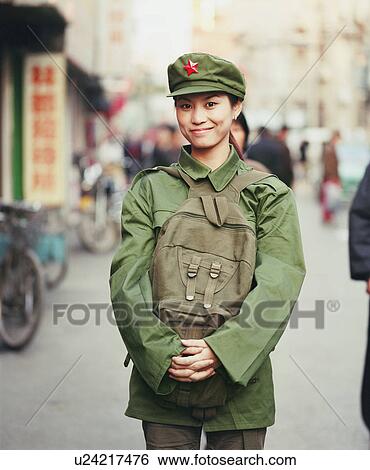 Portrait of a young woman in the army uniform standing in a street View Large Photo Image Stock Photograph - Portrait of a young woman in the army uniform standing in a street. Fotosearch