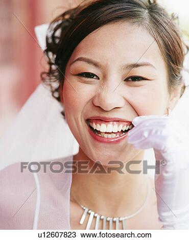 Portrait of a young woman in the wedding dress View Large Photo Image Stock Image - Portrait of a young woman in the wedding dress. Fotosearch