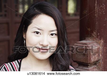Picture - Portrait of a young woman smiling. Fotosearch