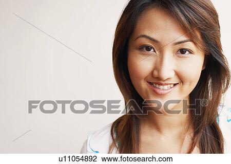 Portrait of a young woman smiling View Large Photo Image Stock Image - Portrait of a young woman smiling. Fotosearch