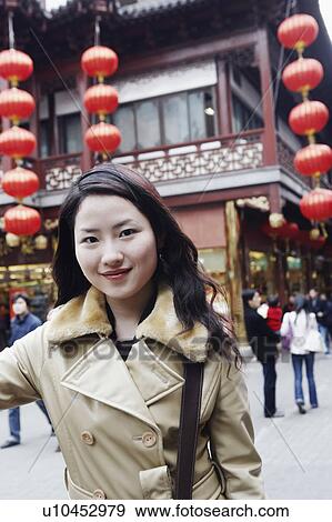Stock Photo - Portrait of a young woman smiling. Fotosearch
