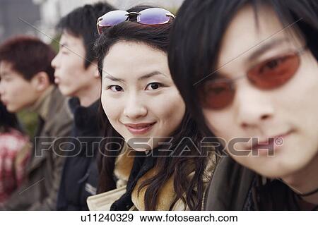 Portrait of a young woman smiling View Large Photo Image Stock Photo - Portrait of a young woman smiling. Fotosearch