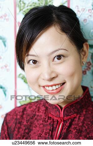Portrait of a young woman smiling View Large Photo Image Stock Photograph - Portrait of a young woman smiling. Fotosearch