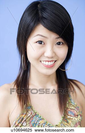 Stock Photography - Portrait of a young woman smiling. Fotosearch