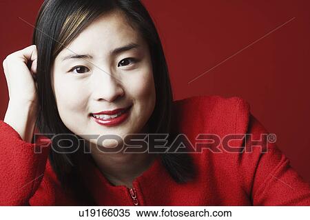 Portrait of a young woman smiling View Large Photo Image Stock Photography - Portrait of a young woman smiling. Fotosearch
