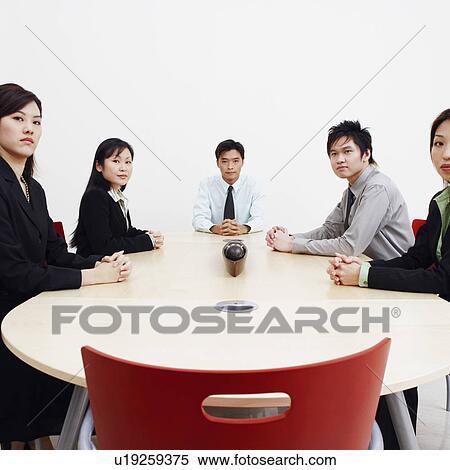 Portrait of business executives sitting in a board room View Large Photo Image Stock Photography - Portrait of business executives sitting in a board room. Fotosearch