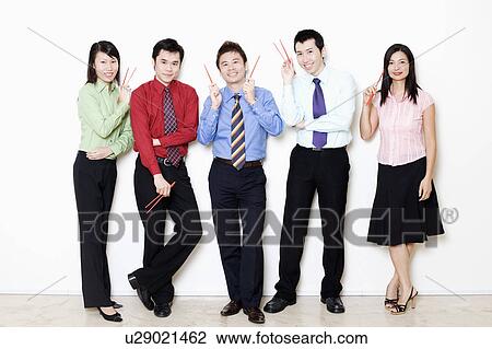 Portrait of five business executives holding chopsticks View Large Photo Image Stock Image - Portrait of five business executives holding chopsticks. Fotosearch
