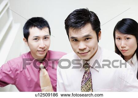 Portrait of three business executives View Large Photo Image Stock Photograph - Portrait of three business executives. Fotosearch