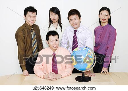 Portrait of two businesswomen and three businessmen smiling View Large Photo Image Stock Photo - Portrait of two businesswomen and three businessmen smiling. Fotosearch