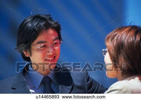 Businessman and businesswoman looking at each other with smile, Pin Focus View Large Photo Image Stock Image - Businessman and businesswoman looking at each other with smile, Pin Focus. Fotosearch