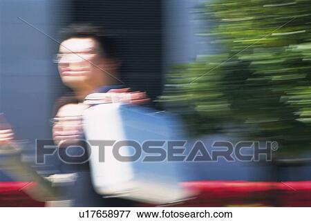 Businessman and businesswoman walking, Blurred Motion, View Large Photo Image Stock Photo - Businessman and businesswoman walking, Blurred Motion,. Fotosearch