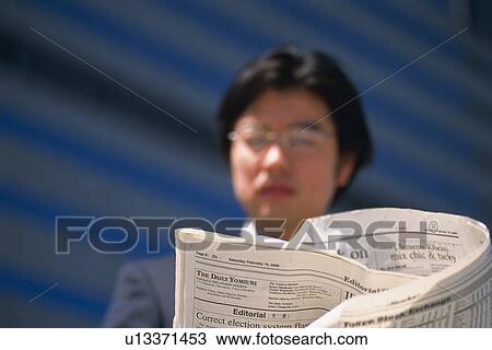 Businessman reading news paper, Low Angle View, Pin Focus, Soft Focus View Large Photo Image Stock Image - Businessman reading news paper, Low Angle View, Pin Focus, Soft Focus. Fotosearch