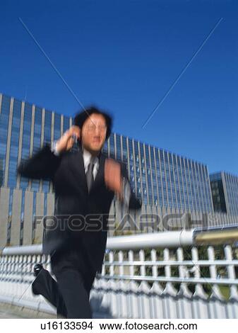 Picture - Businessman running, Blurred Motion. Fotosearch