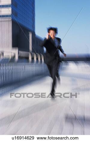 Businessman running, Blurred Motion View Large Photo Image Stock Photo - Businessman running, Blurred Motion. Fotosearch