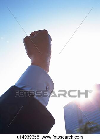 Fist up in the air, Lens Flare View Large Photo Image Stock Photo - Fist up in the air, Lens Flare. Fotosearch