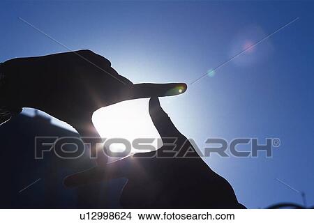 Picture - Fngers making frame, Lens Flare, Silhouette . Fotosearch