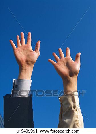 Two raised hands, Low Angle View View Large Photo Image Stock Image - Two raised hands, Low Angle View. Fotosearch