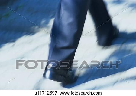 Walking feet, rear view, Blurred Motion View Large Photo Image Stock Photo - Walking feet, rear view, Blurred Motion. Fotosearch