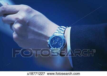 Wrist wearing watch, Close Up View Large Photo Image Stock Photo - Wrist wearing watch, Close Up. Fotosearch
