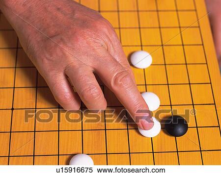 Hand playing Go, Close Up View Large Photo Image Stock Photography - Hand playing Go, Close Up. Fotosearch